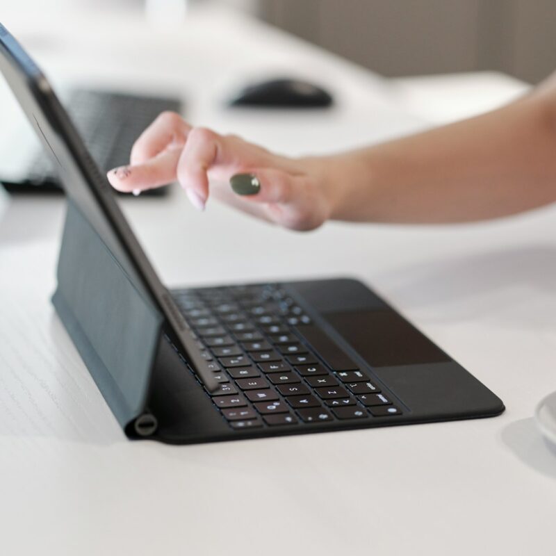 a person using a laptop computer on a table